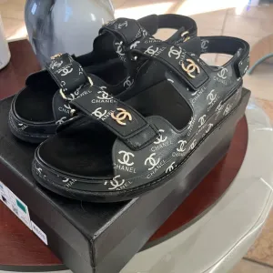 Chanel Black Sandals with Gold Accents