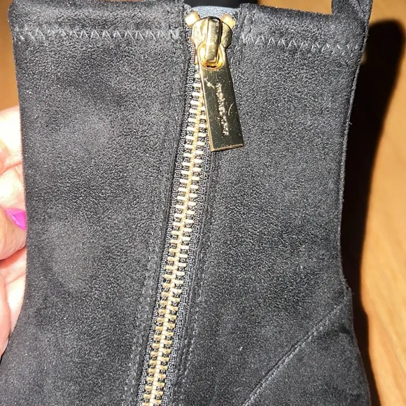 Suede Michael Kors Pointy boots with a comfortable heel.