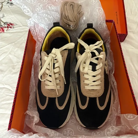 Tory Burch. Good luck trainers.Stylish Black and Tan Women's Sneakers.