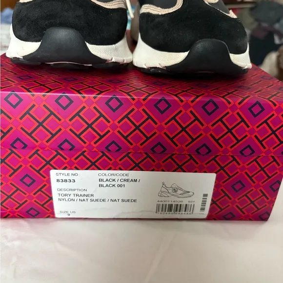 Tory Burch. Good luck trainers.Stylish Black and Tan Women's Sneakers.