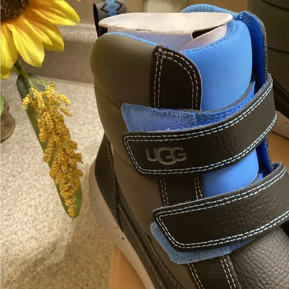 UGG Kids Black and Blue High-Top boots.
