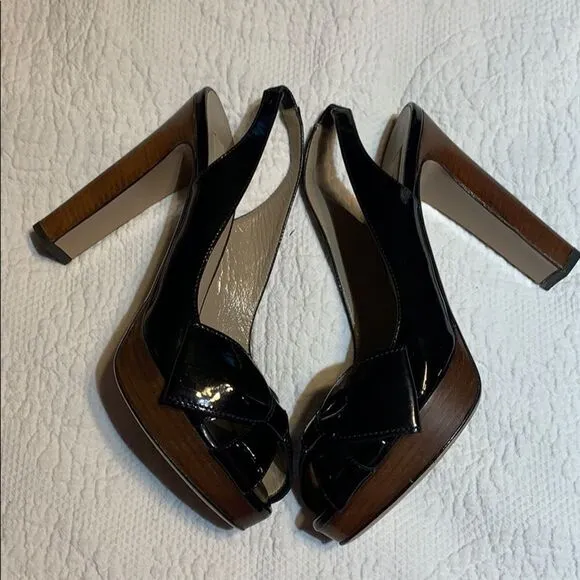 Valentino Garavani Patent sling back bow heels. 38